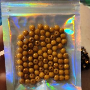 Small Light Brown Plastic Or Acrylic Beads in Holographic Pouch